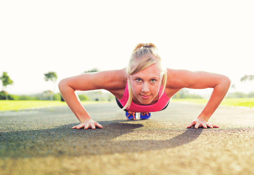 A woman performing push-ups with perfect form